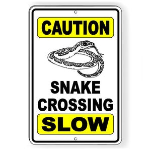 CAUTION SNAKE CROSSING